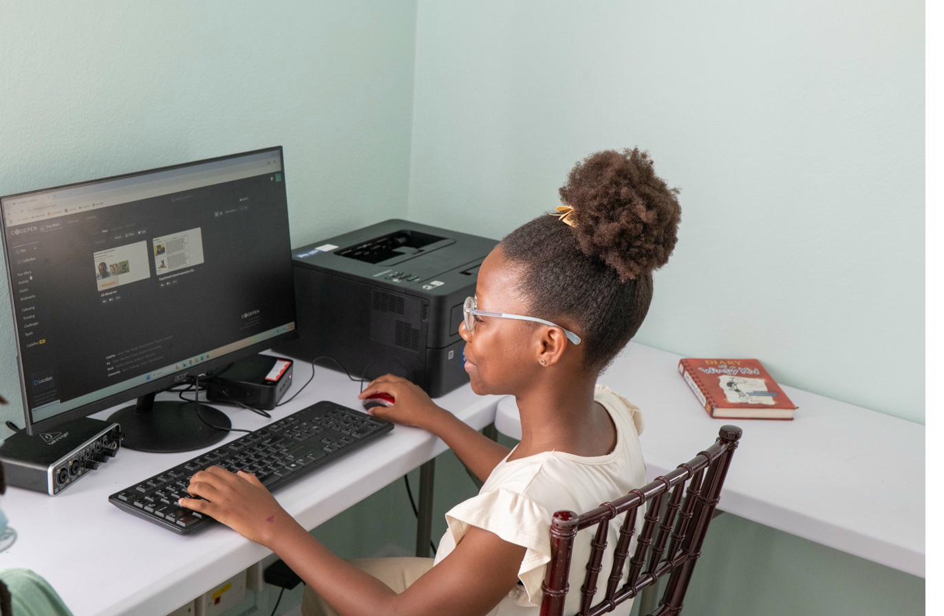 Student at keyboard during Island Innovators Bahamas 2025