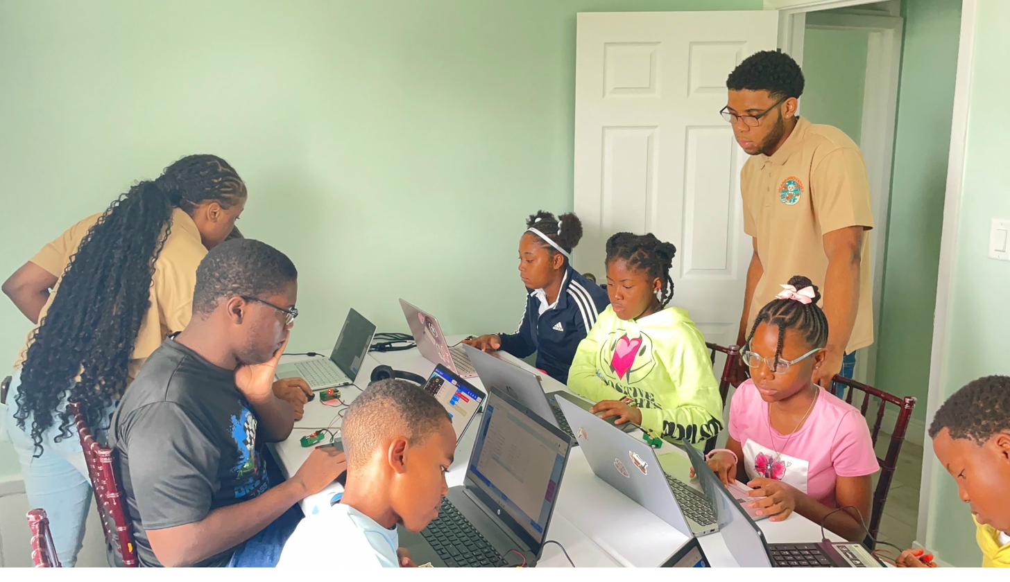 Island Innovators Bahamas 2025 — students and instructors working together