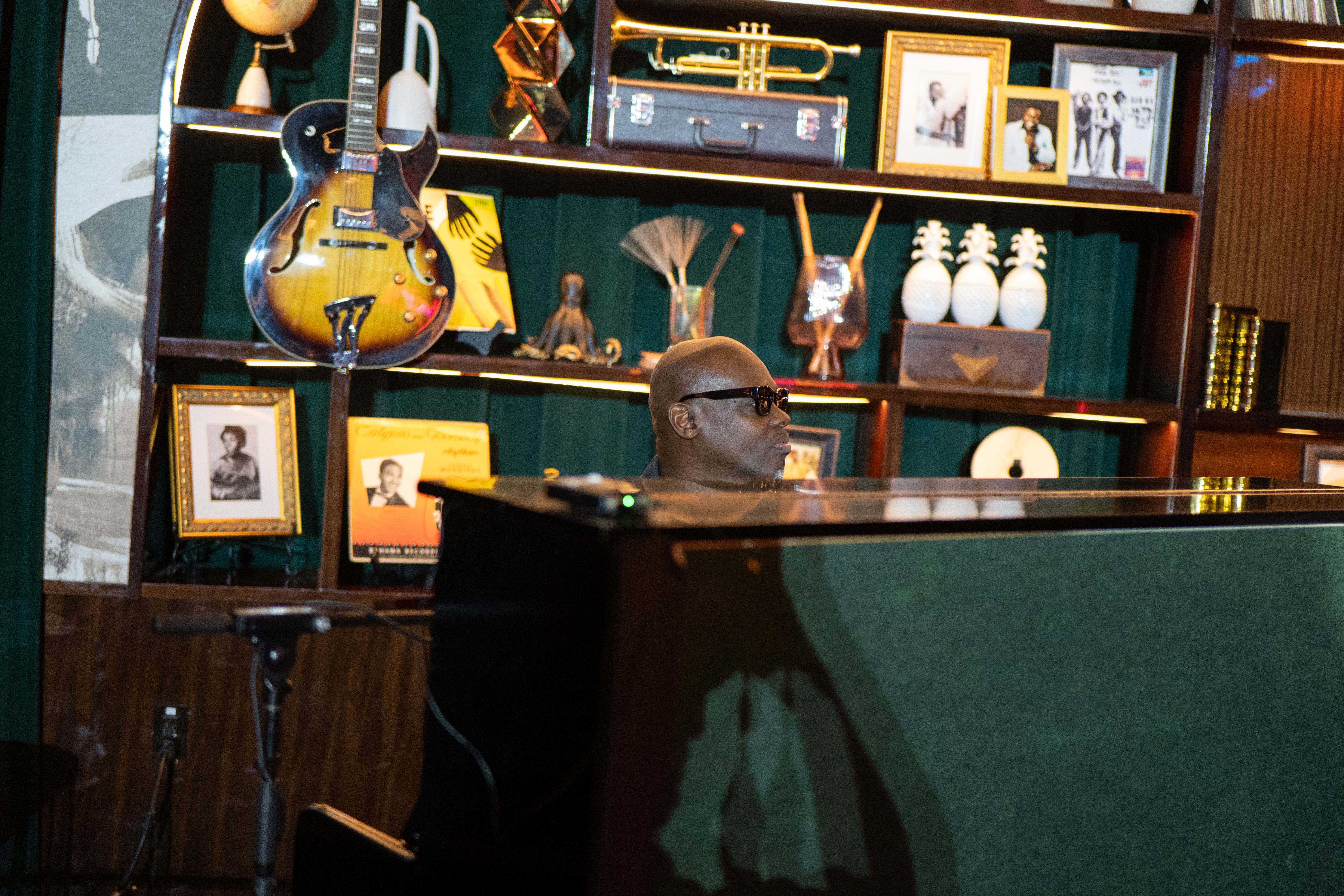Musician at grand piano at Jon Batiste's Jazz Club during the Island Innovators Bahamas 2026 field trip