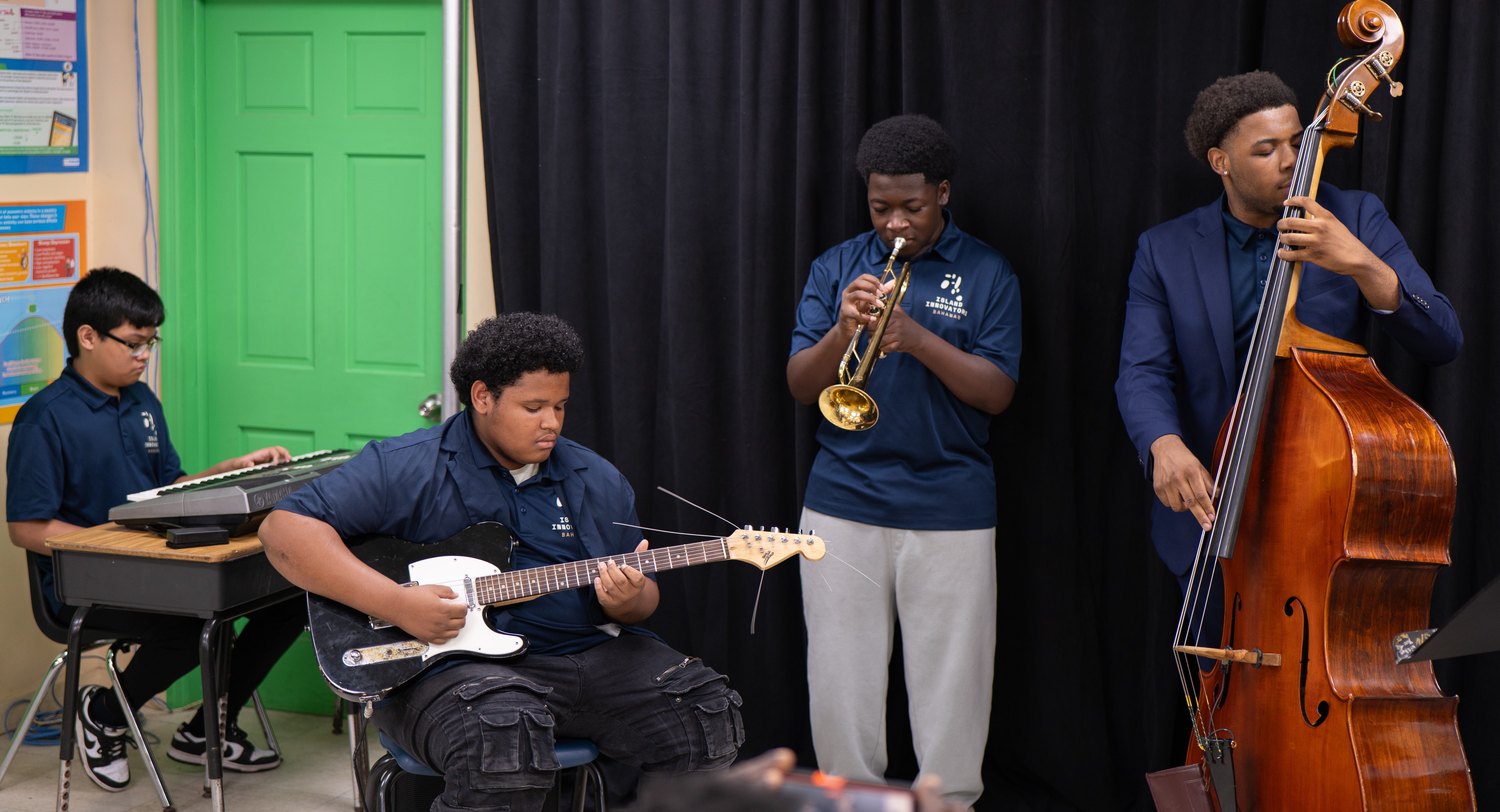 Island Innovators Bahamas 2026 students performing as a band at the public showcase