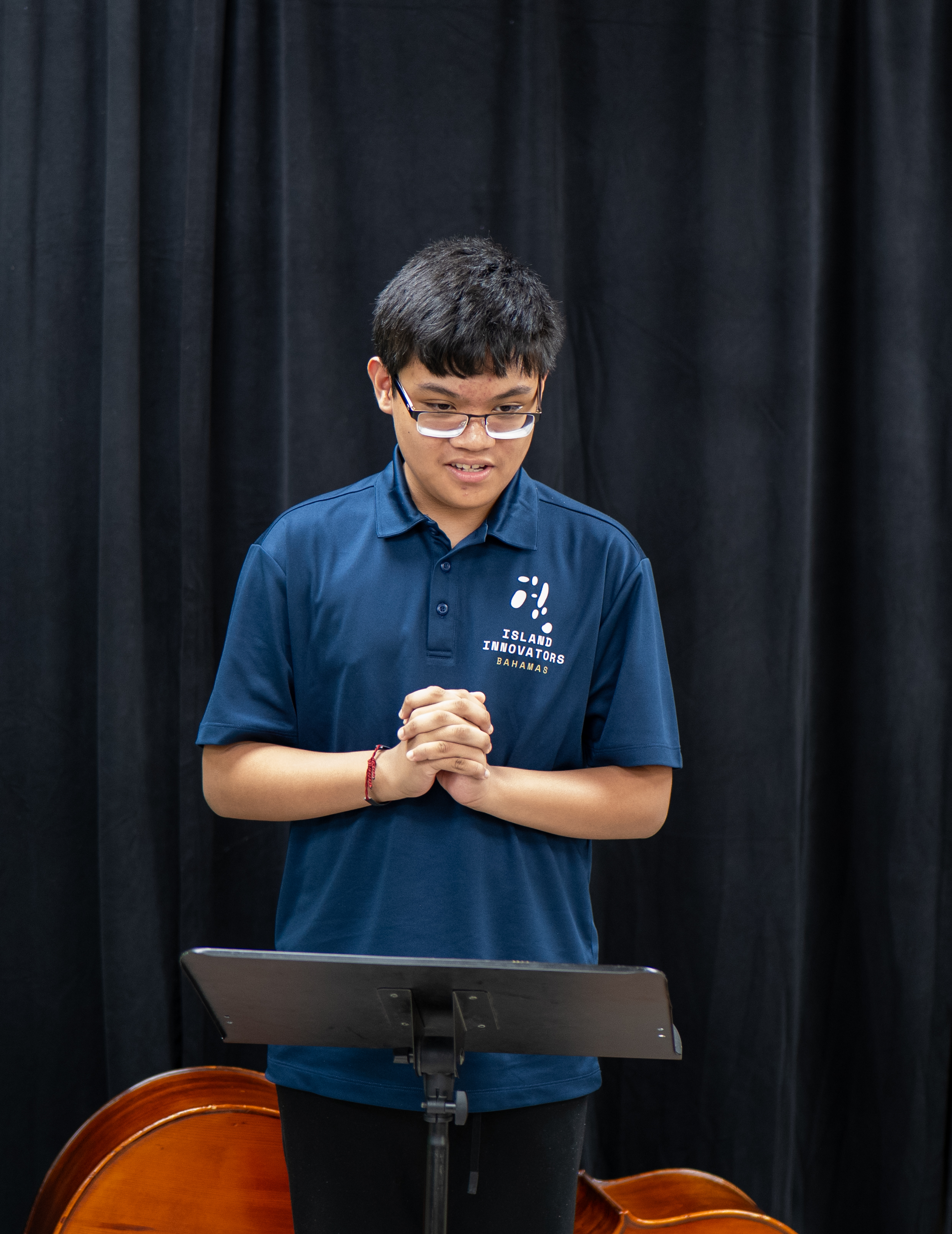 Island Innovators Bahamas 2026 student presenting at the showcase podium